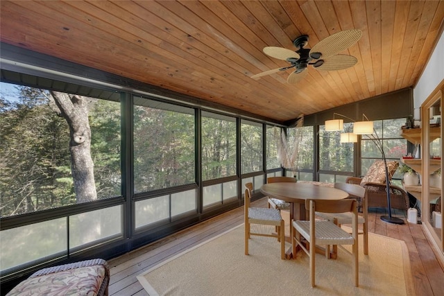 sunroom with outdoor dining space and ceiling fan