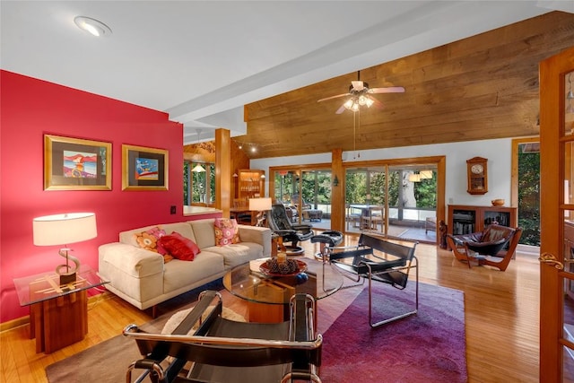living room featuring a ceiling fan and wood finished floors