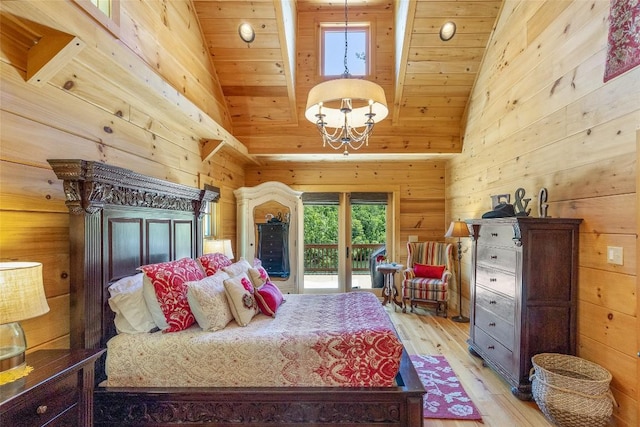 bedroom featuring high vaulted ceiling, access to exterior, wooden walls, and light wood-style flooring