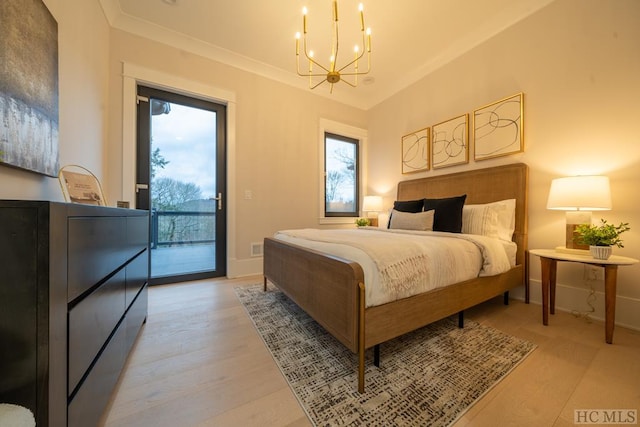 bedroom featuring a notable chandelier, multiple windows, access to outside, and light wood-type flooring