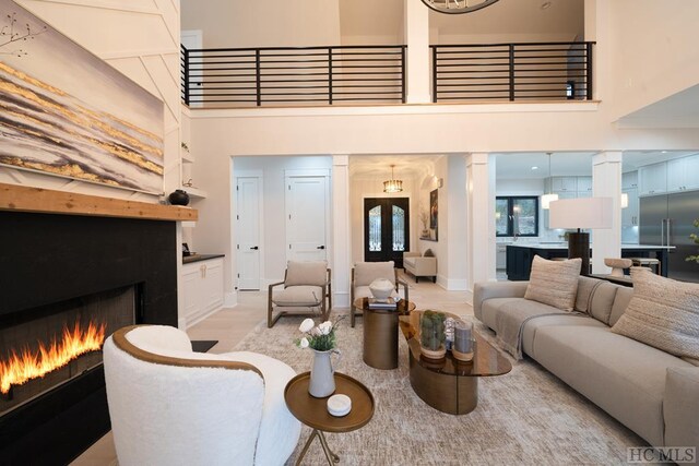 living room featuring light hardwood / wood-style flooring and french doors