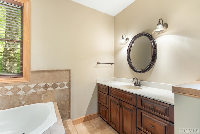 bathroom featuring a tub and vanity