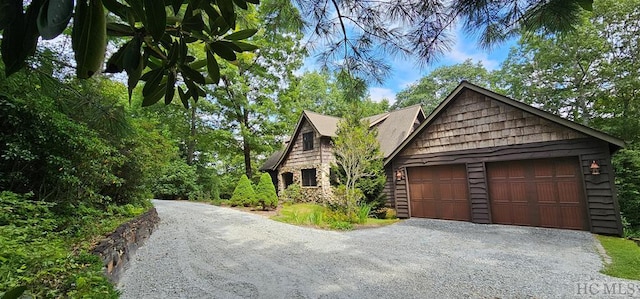 view of side of property featuring a garage