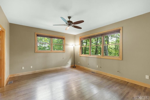 unfurnished room featuring ceiling fan and light hardwood / wood-style floors