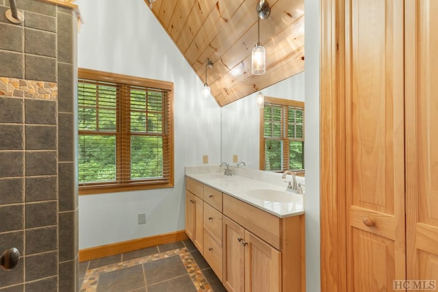 bathroom featuring vanity, vaulted ceiling, and wood ceiling