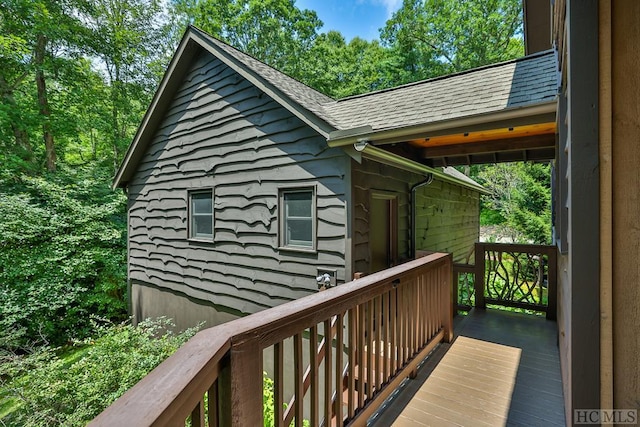 view of side of property with a wooden deck