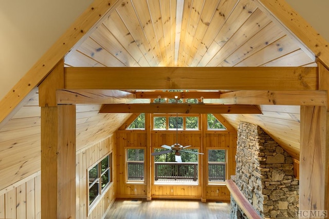 bonus room with wood ceiling, light hardwood / wood-style floors, vaulted ceiling with beams, and wood walls