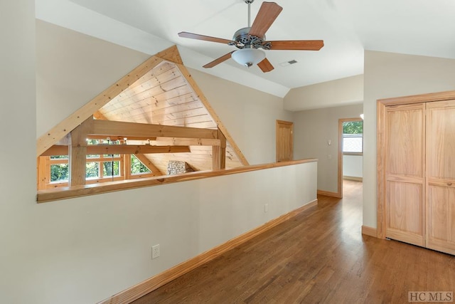 interior space with vaulted ceiling and wood-type flooring