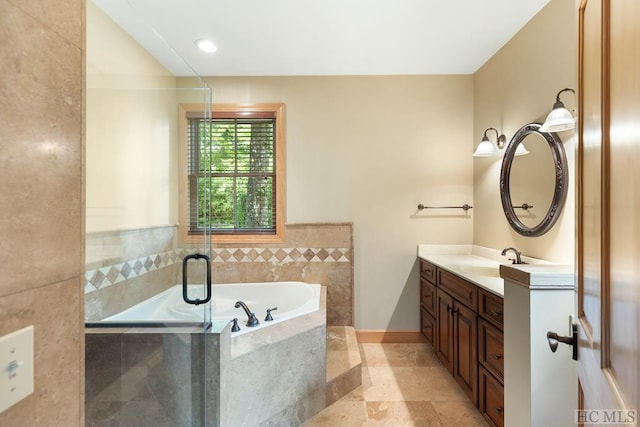 bathroom featuring vanity, shower with separate bathtub, and tile walls