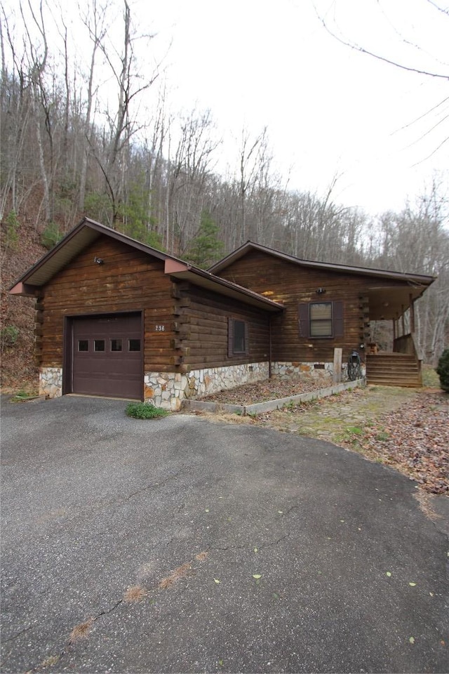 view of side of property featuring a garage