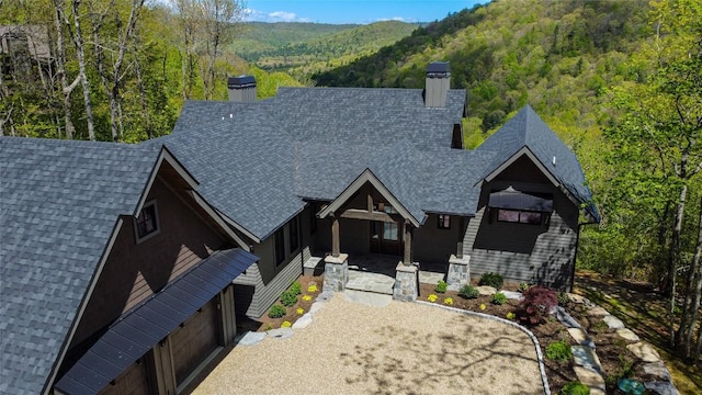 369 Firesong Ln, Glenville, NC 28736 - view of front of home with a chimney, roof with shingles, and a view of trees