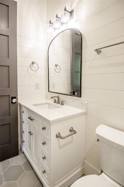 369 Firesong Ln, Glenville, NC 28736 - half bathroom featuring toilet, vanity, and tile patterned floors