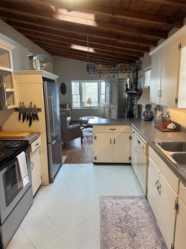 kitchen featuring appliances with stainless steel finishes, kitchen peninsula, cream cabinets, and wooden ceiling