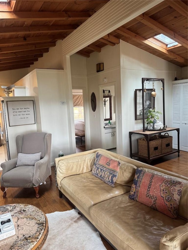 living room featuring wood ceiling, lofted ceiling with skylight, and hardwood / wood-style flooring