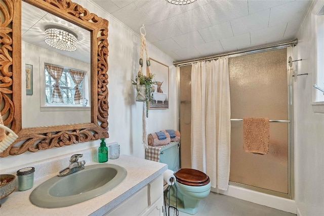 full bathroom featuring tile patterned floors, a shower stall, toilet, and vanity