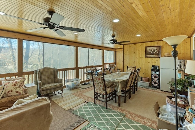 3731 Dillard Rd, Highlands, NC 28741 - dining room with wood ceiling, a ceiling fan, plenty of natural light, carpet flooring, and wooden walls