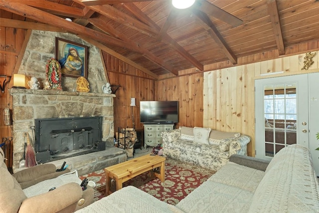 living room with vaulted ceiling with beams, wooden ceiling, and wooden walls