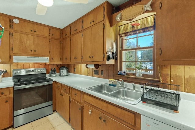 kitchen featuring sink, light tile patterned floors, dishwasher, ceiling fan, and stainless steel electric stove