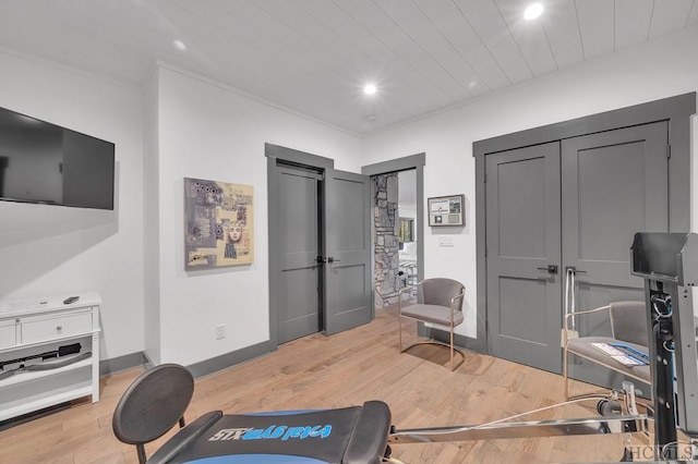 exercise room featuring light hardwood / wood-style flooring