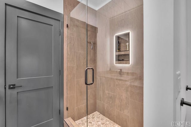 bathroom with a shower with shower door