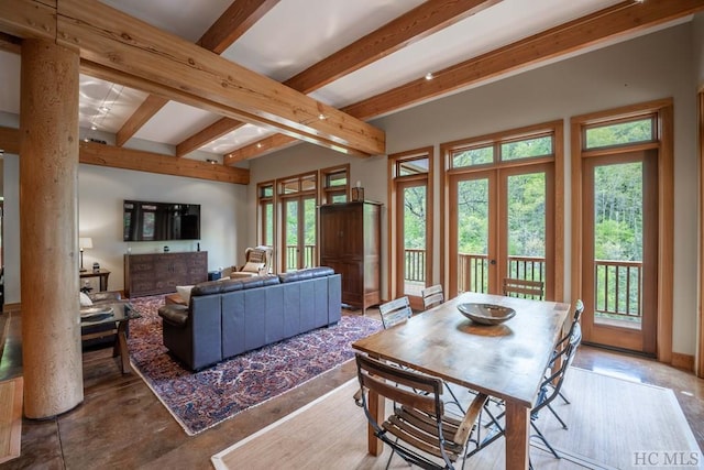 interior space with beam ceiling and french doors