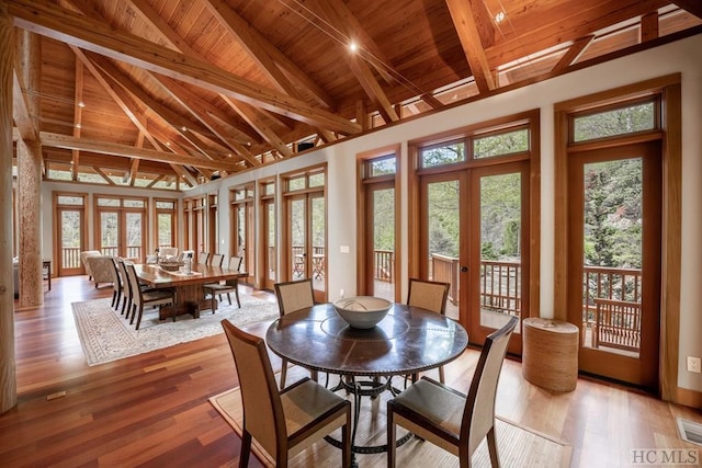 sunroom featuring wood ceiling, french doors, and lofted ceiling with beams