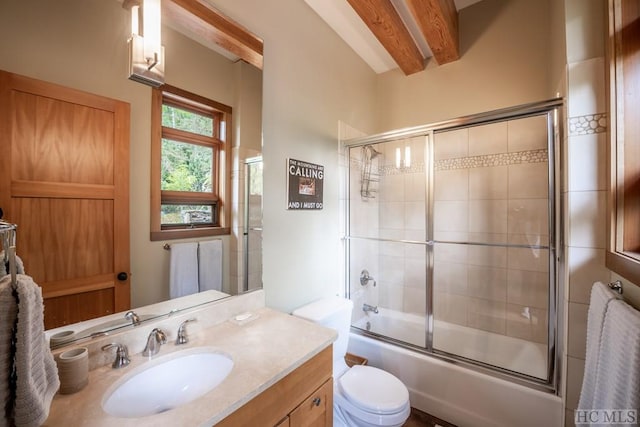 bathroom with toilet, shower / bath combination with glass door, beamed ceiling, and vanity