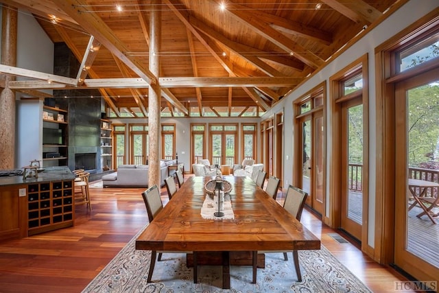 dining room featuring wooden ceiling, plenty of natural light, and light wood-style floors