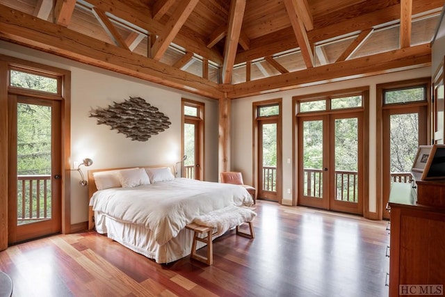 bedroom featuring lofted ceiling, light wood-style floors, and access to exterior