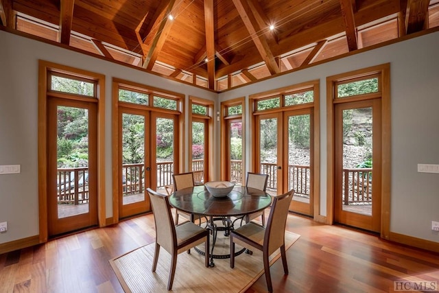 sunroom featuring wooden ceiling, a wealth of natural light, and french doors