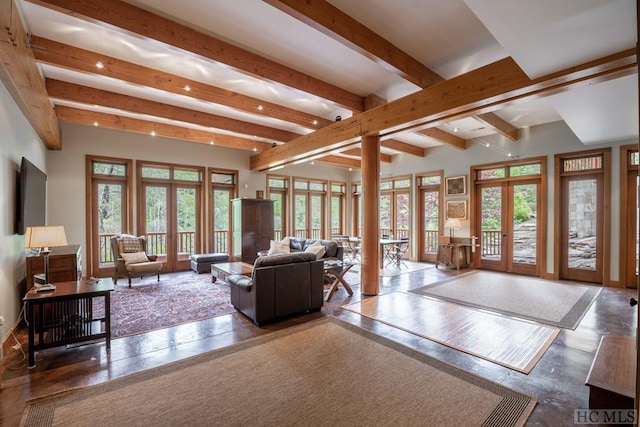 living room featuring beamed ceiling and french doors