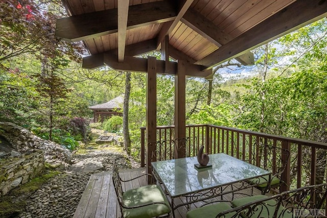 wooden deck featuring outdoor dining space