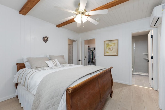 142 Wheatstone Dr, Glenville, NC 28736 - bedroom featuring beam ceiling, light wood-style floors, a spacious closet, a wall mounted AC, and a closet