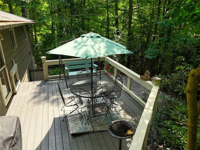 142 Wheatstone Dr, Glenville, NC 28736 - deck featuring outdoor dining space and a wooded view