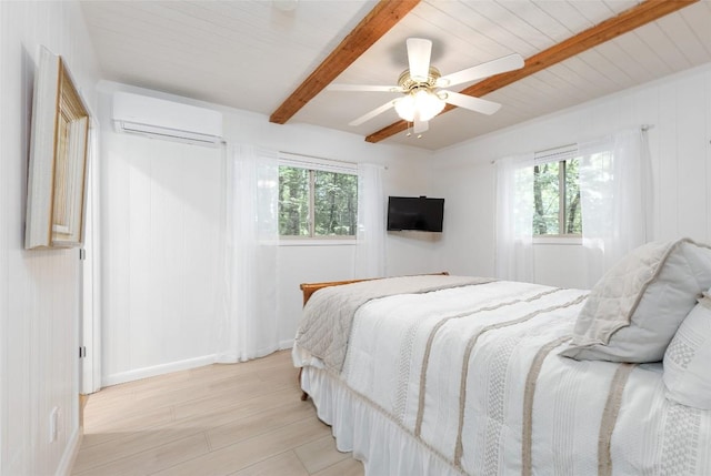 142 Wheatstone Dr, Glenville, NC 28736 - bedroom with a wall mounted AC, multiple windows, beamed ceiling, light wood-type flooring, and a ceiling fan