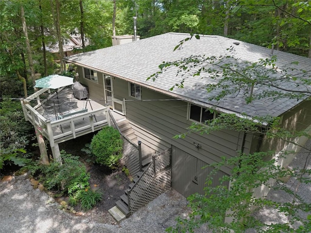 142 Wheatstone Dr, Glenville, NC 28736 - rear view of house featuring roof with shingles, a deck, and a chimney