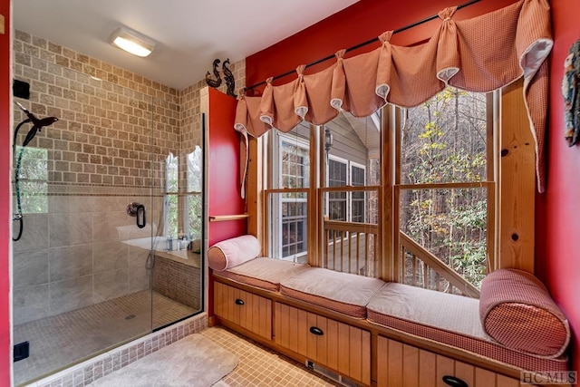 bathroom featuring a tile shower