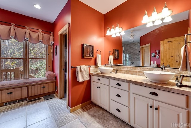 bathroom featuring tile patterned floors, ceiling fan, vanity, and walk in shower