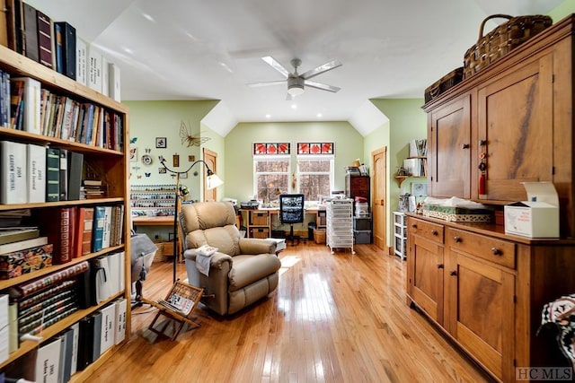 sitting room with vaulted ceiling, ceiling fan, and light hardwood / wood-style flooring