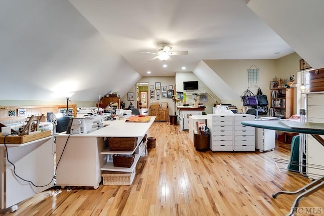 interior space with ceiling fan, light hardwood / wood-style flooring, and vaulted ceiling