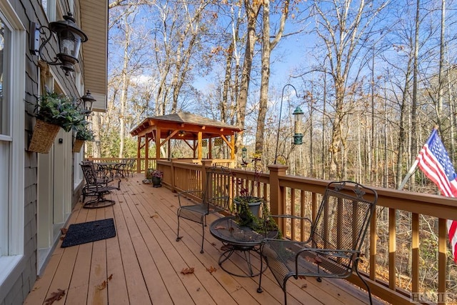 wooden deck featuring a gazebo