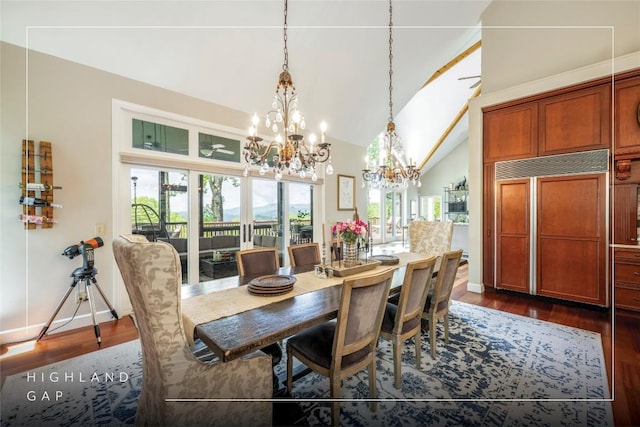 dining area with a chandelier, dark wood-type flooring, high vaulted ceiling, and baseboards