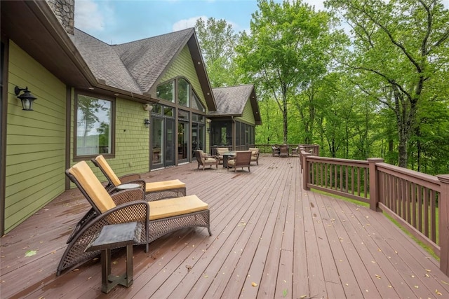 wooden deck with an outdoor fire pit