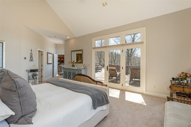 carpeted bedroom with access to exterior, high vaulted ceiling, and baseboards