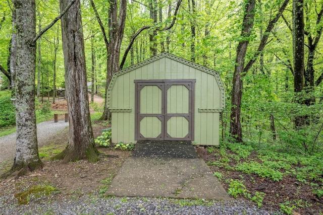 view of shed featuring a forest view
