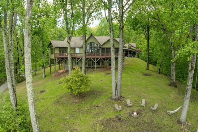 view of front facade featuring a deck and a front yard