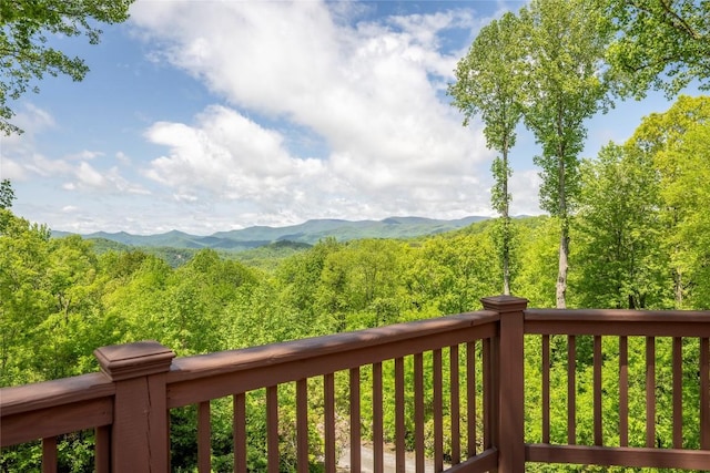 view of mountain backdrop with a forest