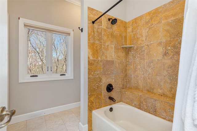 full bath with baseboards and bathing tub / shower combination
