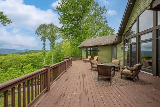 wooden deck featuring an outdoor hangout area