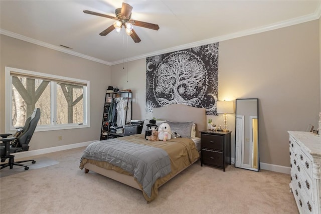 bedroom featuring ornamental molding, light colored carpet, baseboards, ceiling fan, and an office area